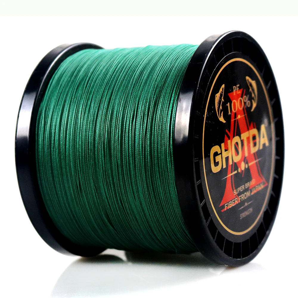 Un carrete de hilo de pescar verde. El carrete tiene una etiqueta que dice GHOSTA, que podría ser la marca del hilo de pescar.
