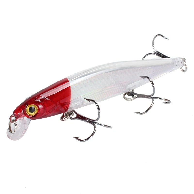 un señuelo de pesca con una cabeza roja y tres ganchos de agudos