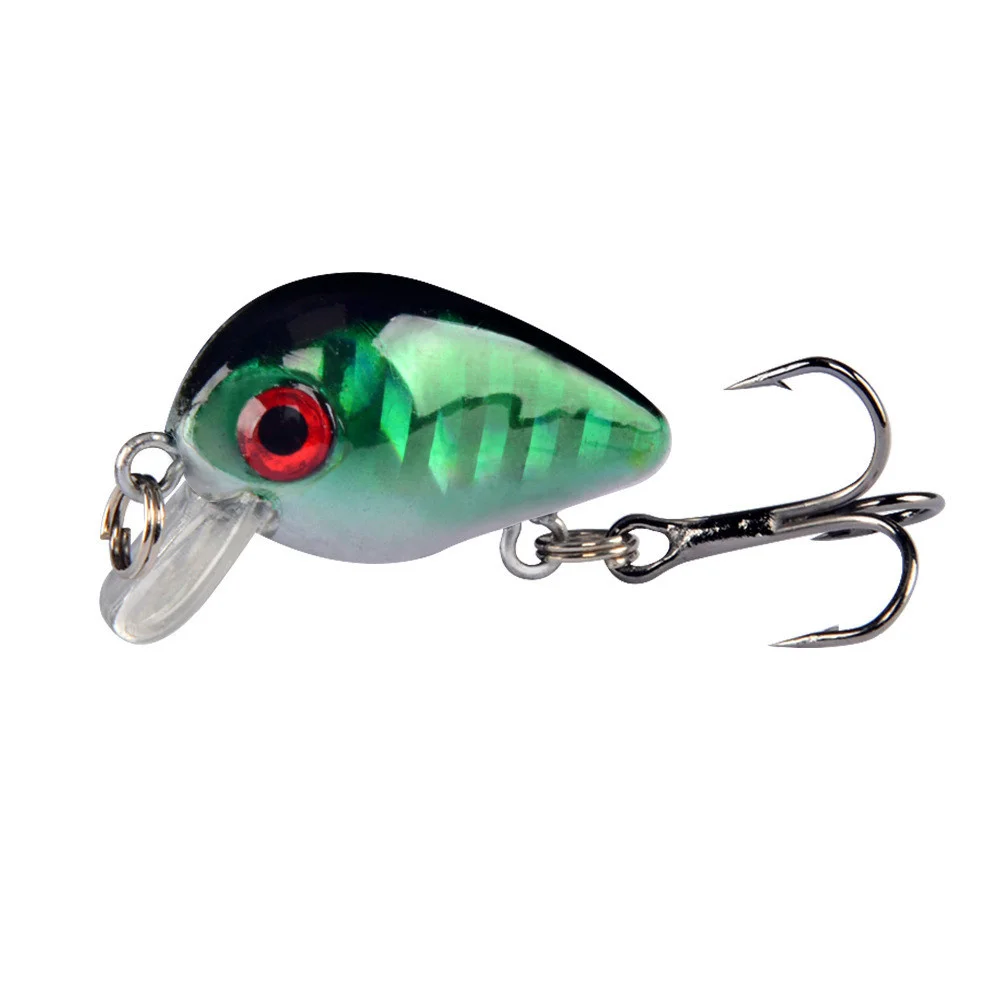 Un pequeño señuelo de pesca verde con un solo gancho