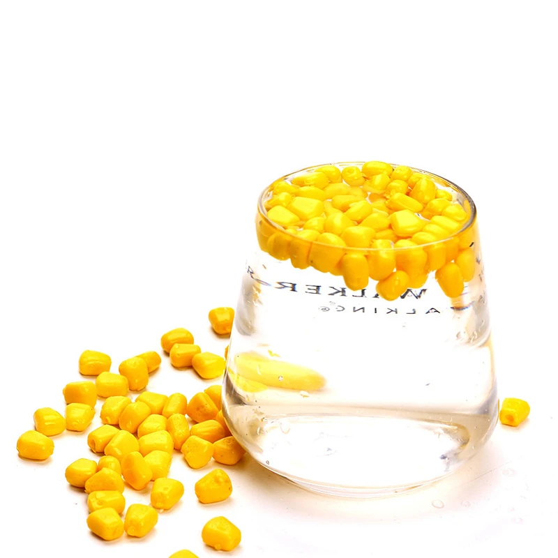 Granos de cebo artificial tipo maíz en tonos amarillos y naranjas