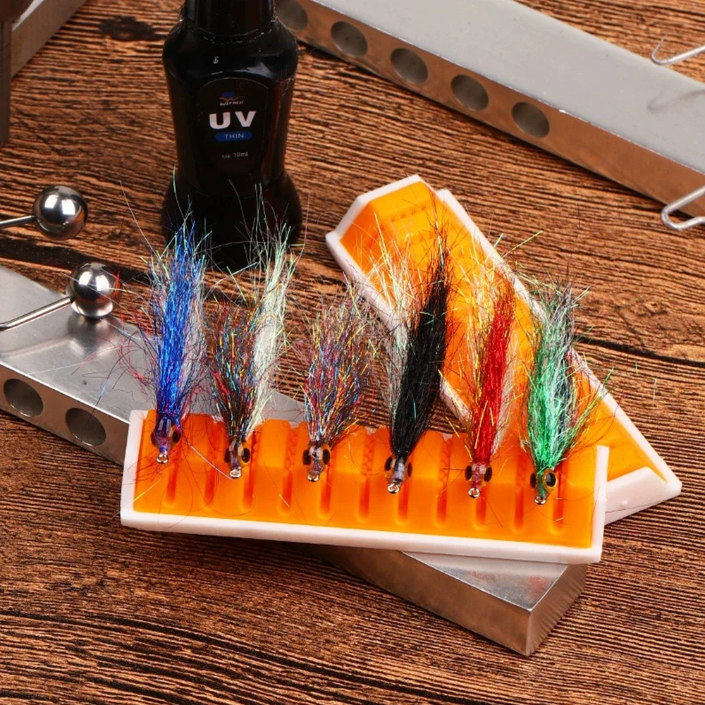 Vista completa del set de 4 organizadores de material para pesca con mosca