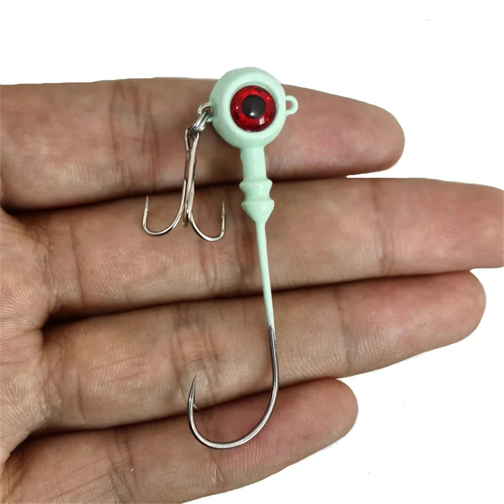 Nuevo 50 Uds anzuelos de Pesca ojo de pez Artificial cebo duro luminoso Jig Head señuelo manivela anzuelo triple aparejos de Pesca accesorios Pesca - imagen 2
