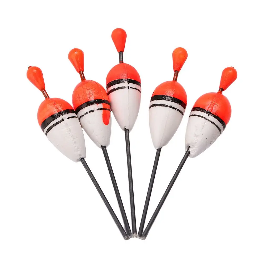 Un grupo de cinco señuelos de pesca naranja y blanca
