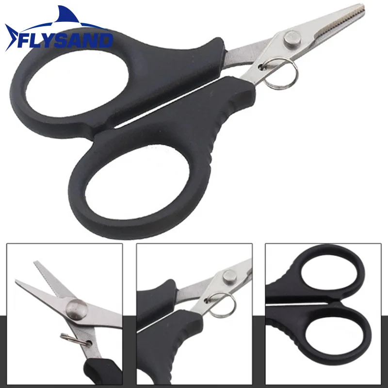 Un par de tijeras negras con un anillo plateado