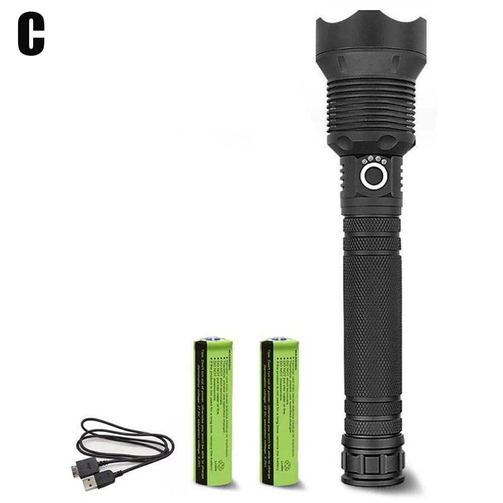 Una linterna negra con dos baterías verdes