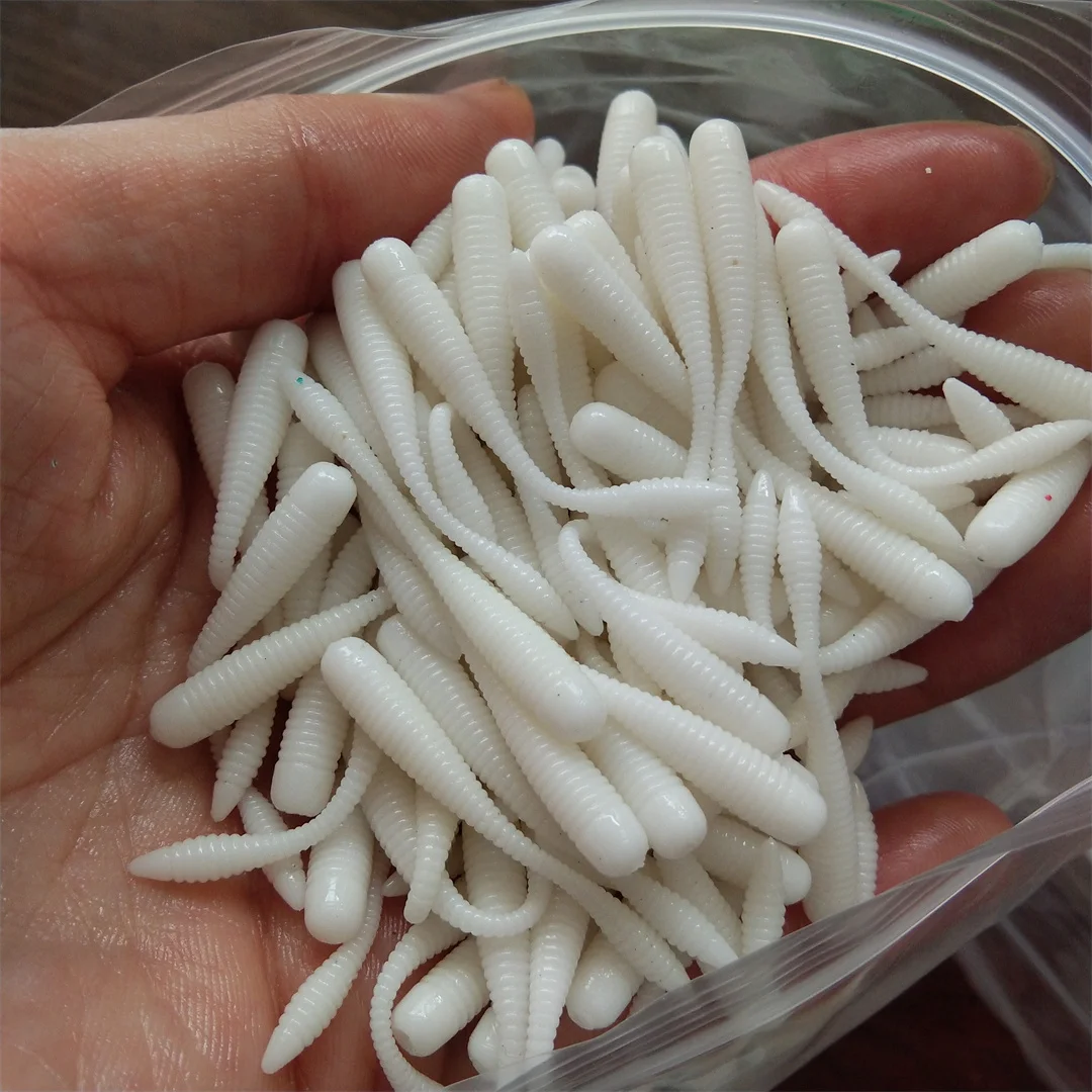 100 Uds 38mm Mini juego de Señuelos de Pesca de raíz Swimbait TPE cebo suave cola de aguja Micro gusano corriente biónica cebos de renacuajo