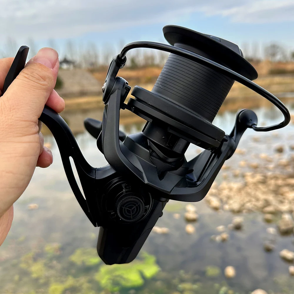 Carretes de pesca giratorios grandes 8000 9000 10000 12000 rueda de fundición larga arrastre 20KG carrete potente para pesca de carpa barco de mar bobina de pescado - imagen 4