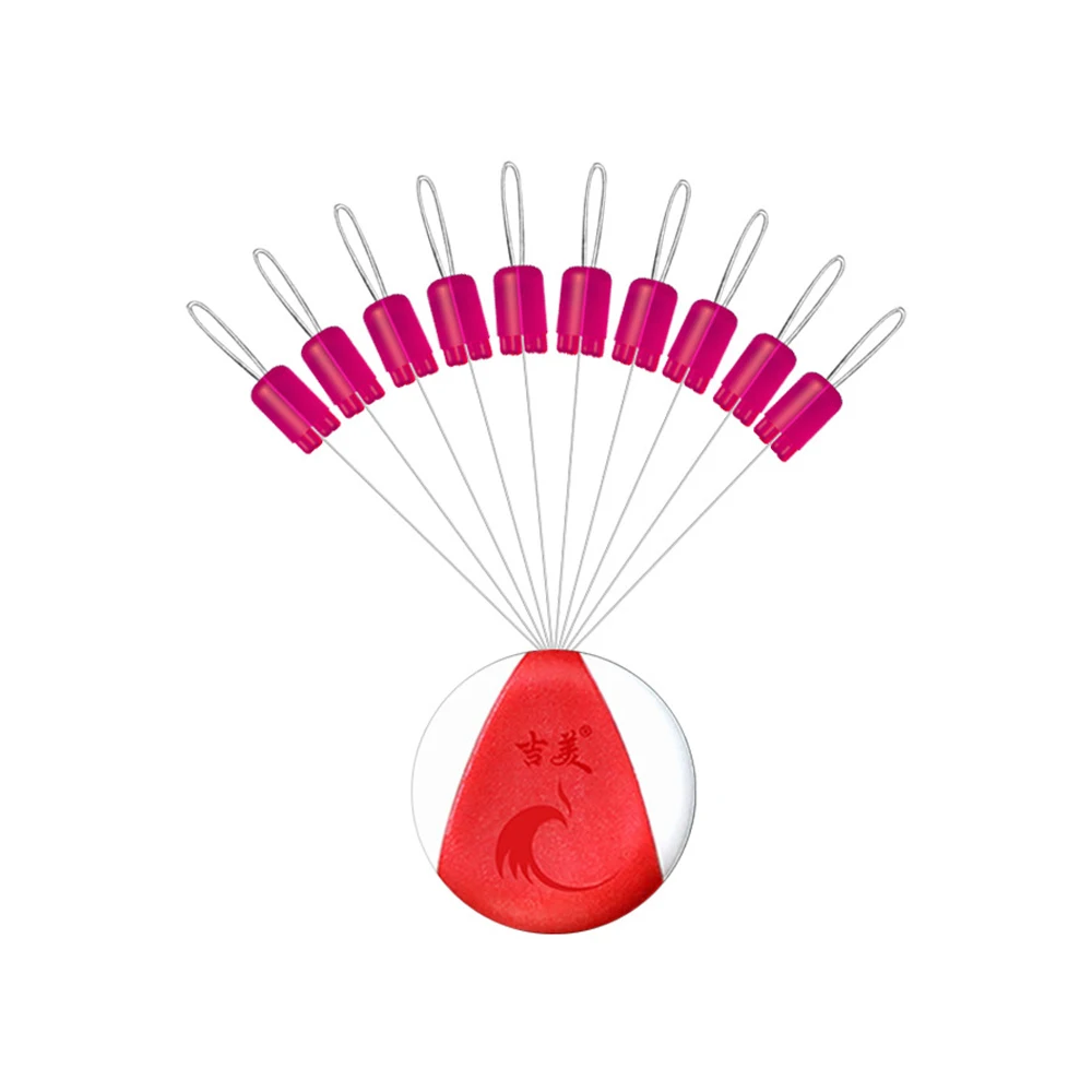 Un conjunto de ganchos de pesca rosa vibrantes unidos a un carrete de pesca duradero, rojo y blanco, perfecto para cualquier equipo de pescador