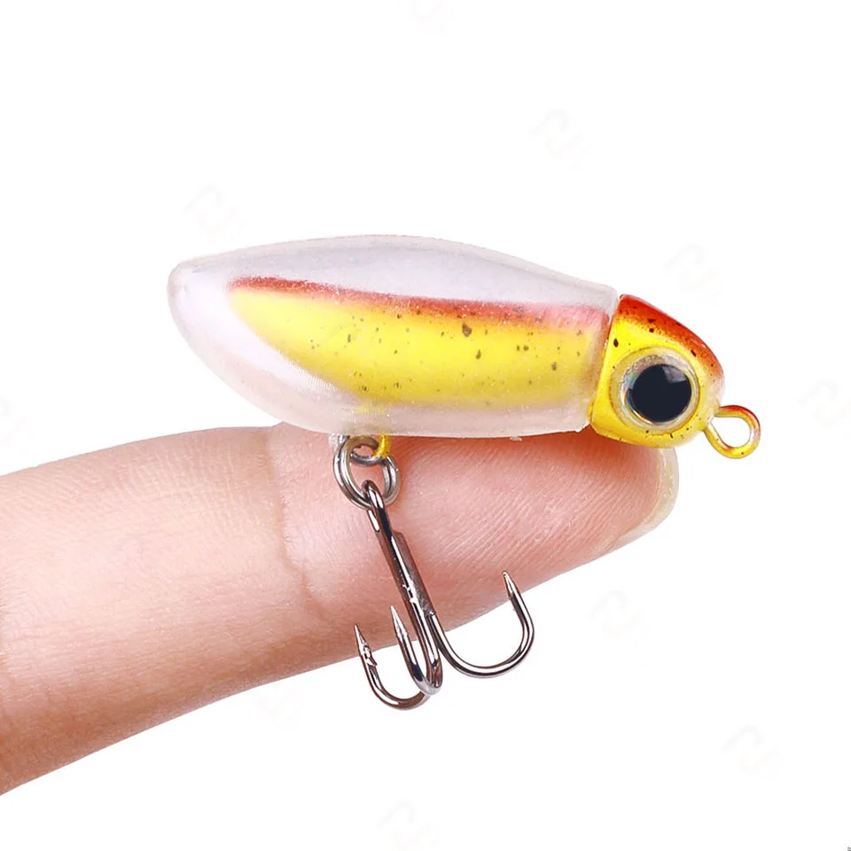 Un pequeño señuelo de pesca con un anzuelo y un accesorio para los ojos