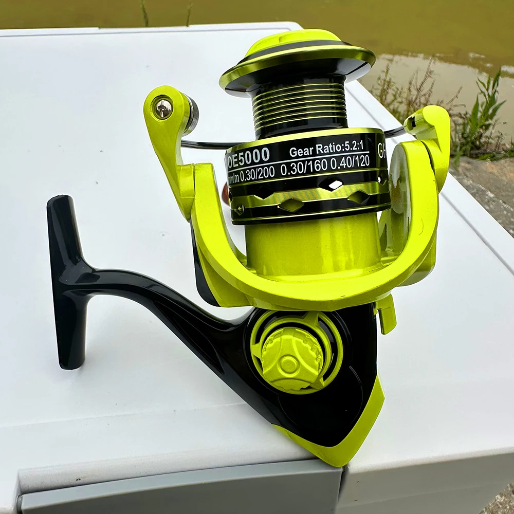 Carrete de pesca con alimentador de carpa serie OE2000-7000, carrete de Metal de agua dulce y salada, arrastre de cuerpo de Metal duradero de 8KG para principiantes/niños - imagen 5