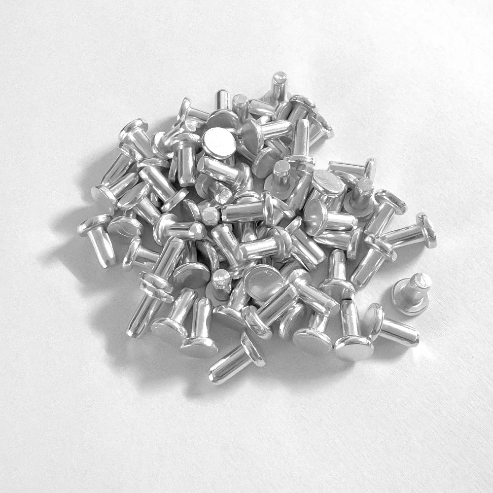 Remaches macizos de aluminio cabeza plana – Punzón de percusión manual