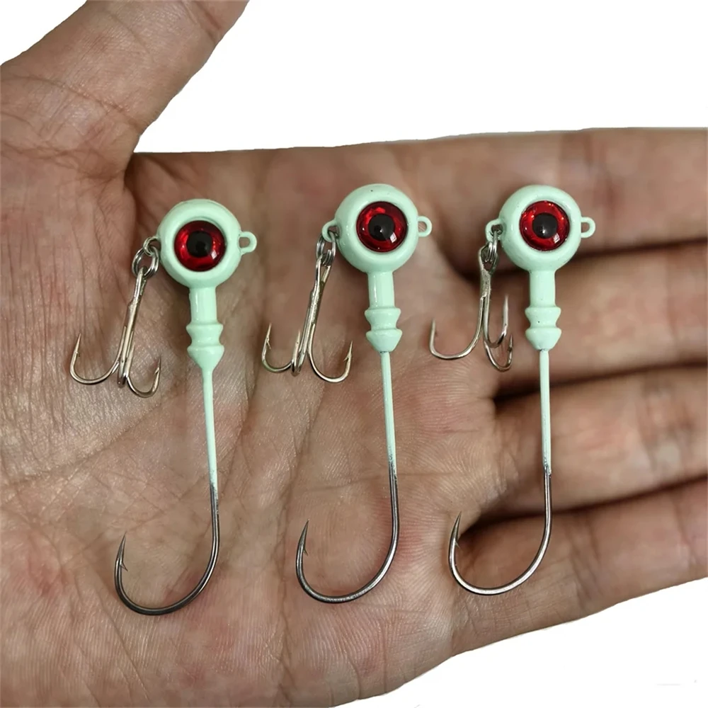 Nuevo 50 Uds anzuelos de Pesca ojo de pez Artificial cebo duro luminoso Jig Head señuelo manivela anzuelo triple aparejos de Pesca accesorios Pesca