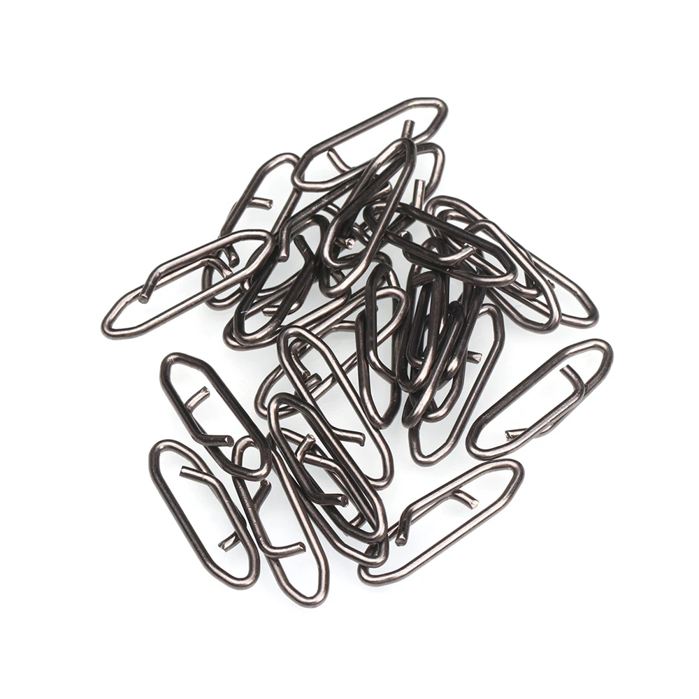 clips de papel negro esparcidos por un fondo blanco