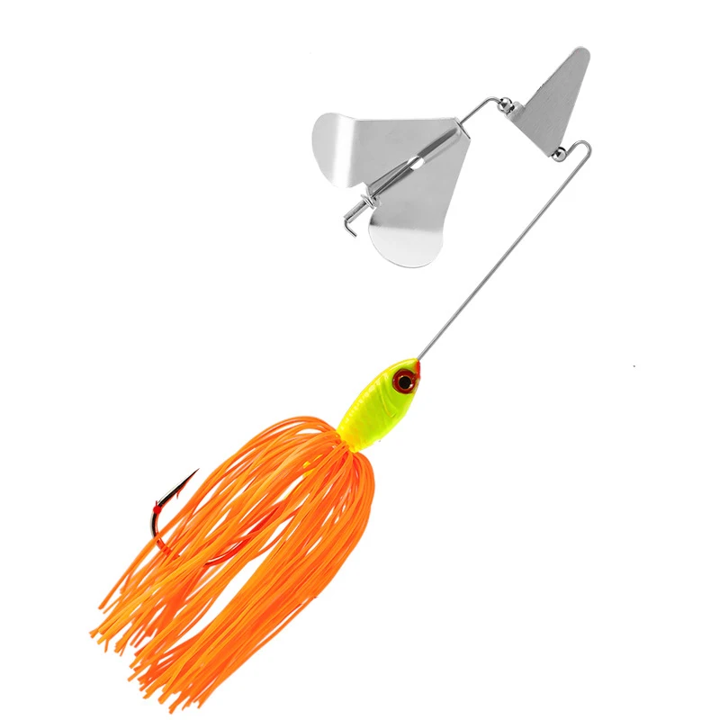 Un señuelo de pesca con una cola naranja brillante y una cabeza de giro de metal brillante