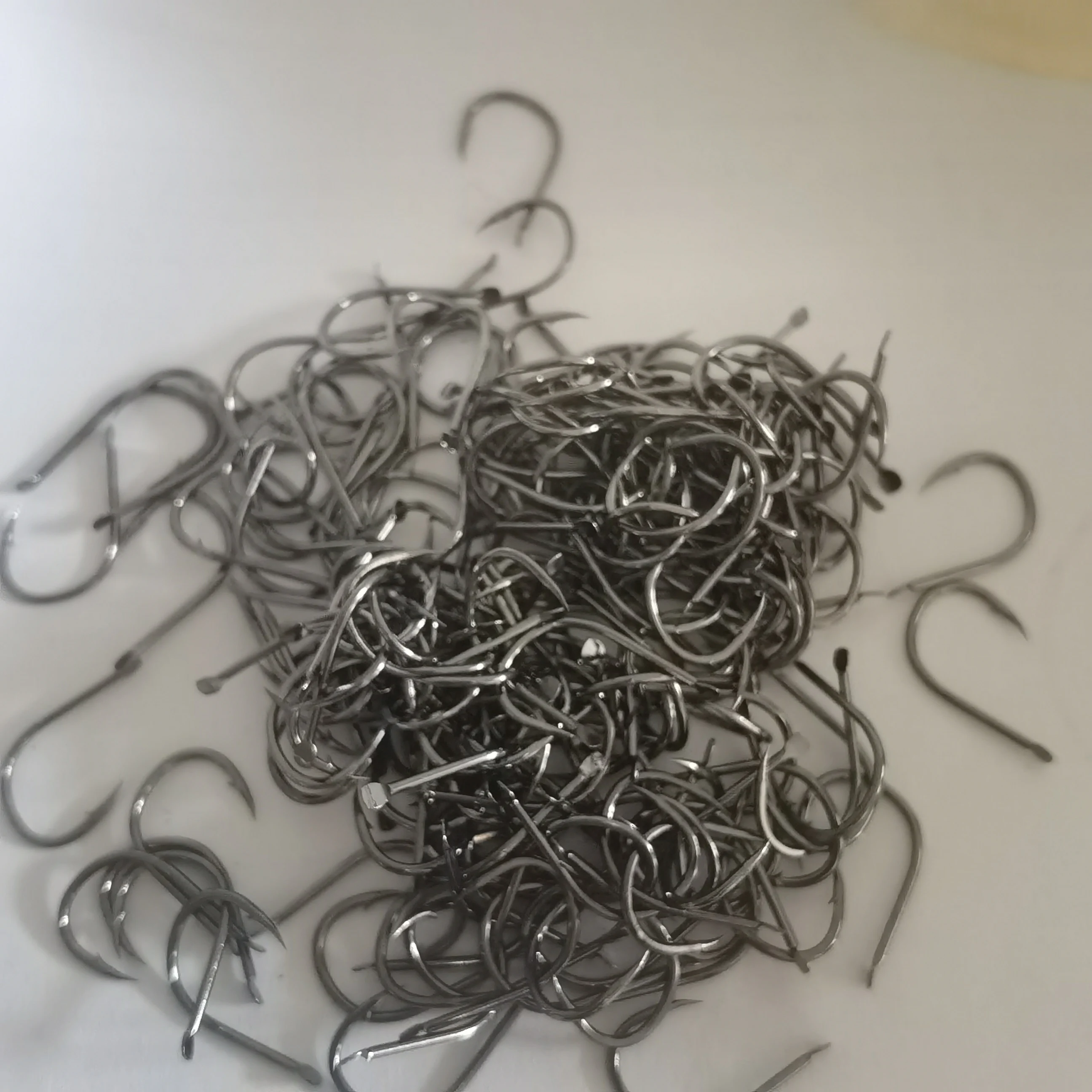 Anzuelos de Pesca de cabeza plana sin ojos, anzuelos de púas para carpa, accesorios de Material de Pesca, 200 Uds. - imagen 3