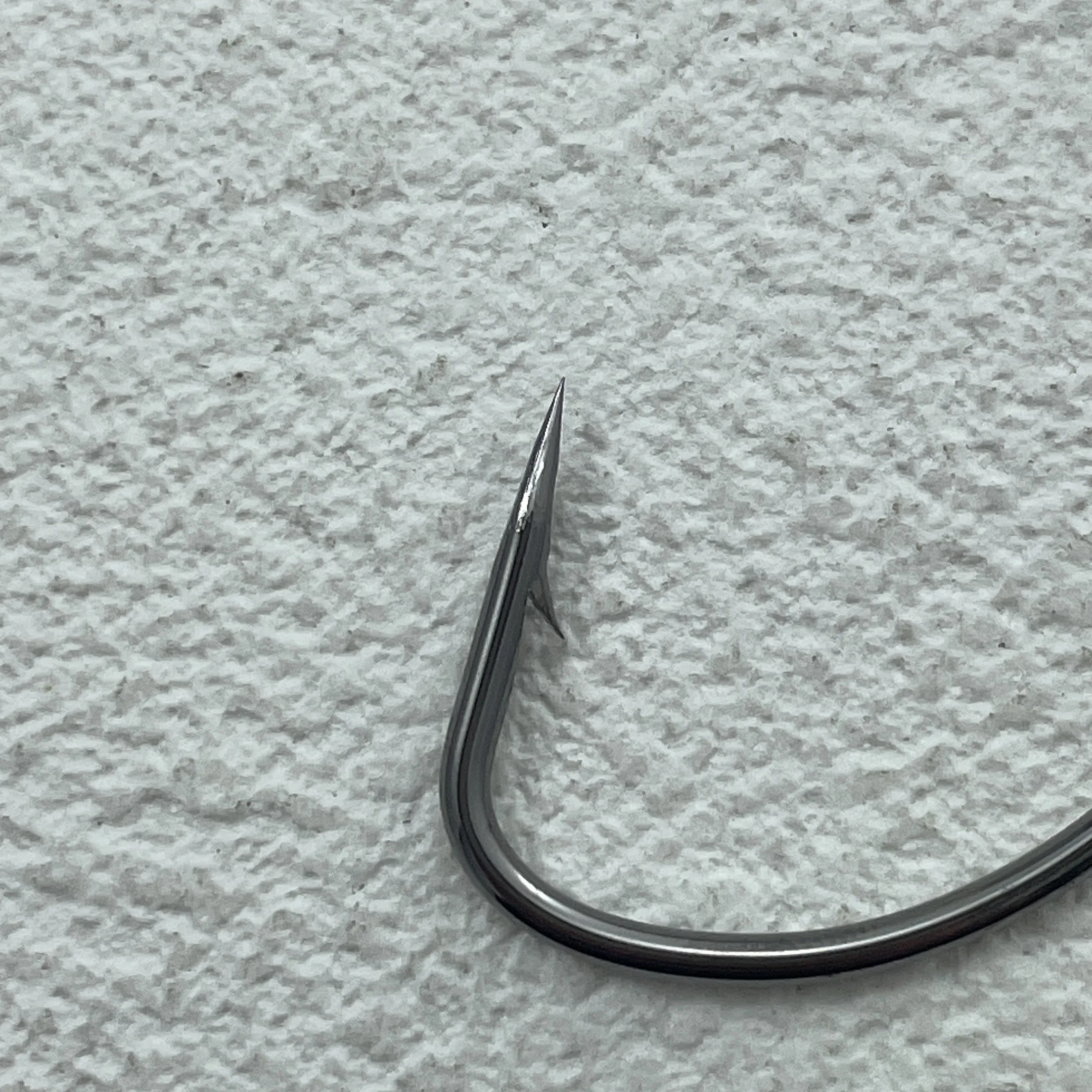 Anzuelos jig y crank con barbas para pesca de mar