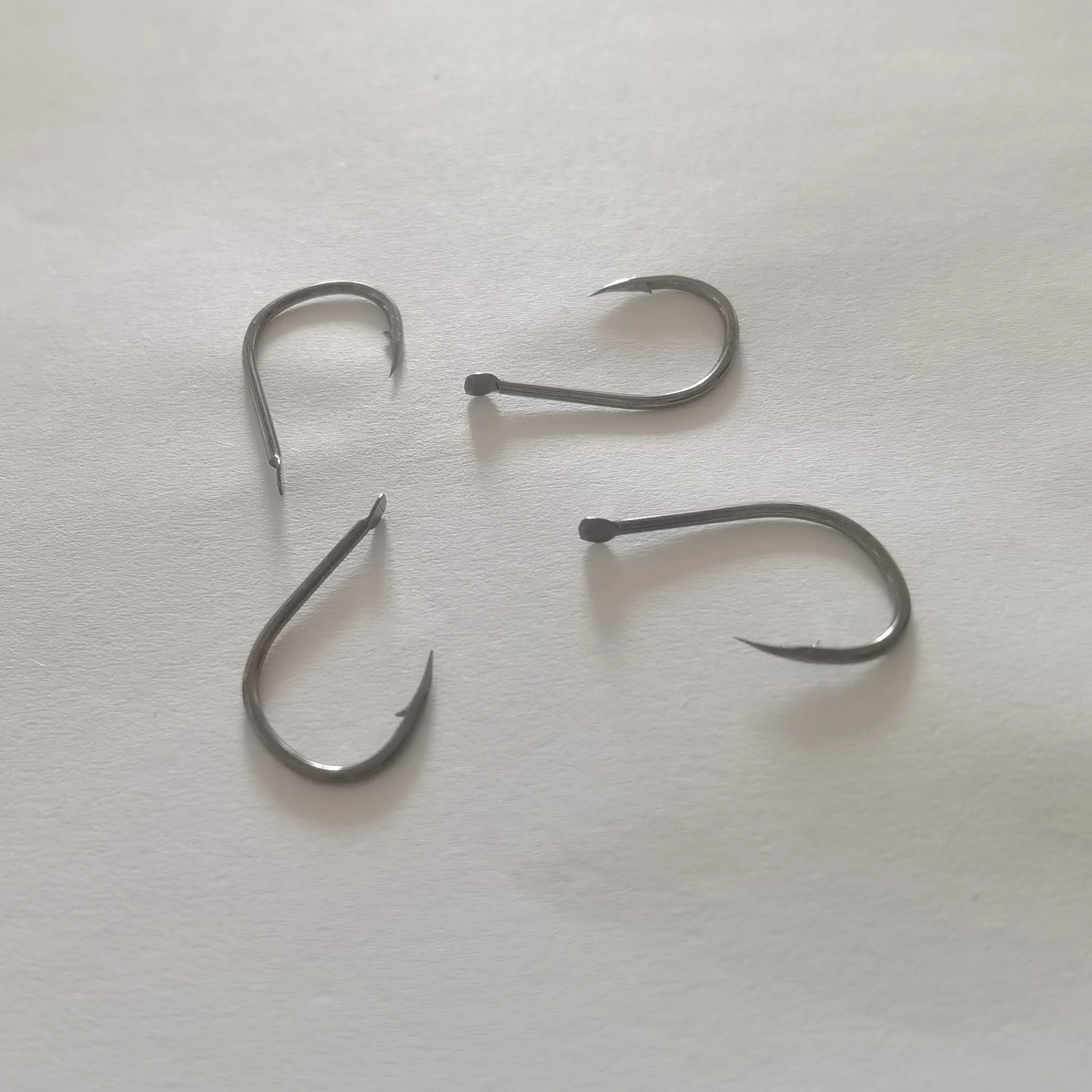 Anzuelos de Pesca de cabeza plana sin ojos, anzuelos de púas para carpa, accesorios de Material de Pesca, 200 Uds. - imagen 5