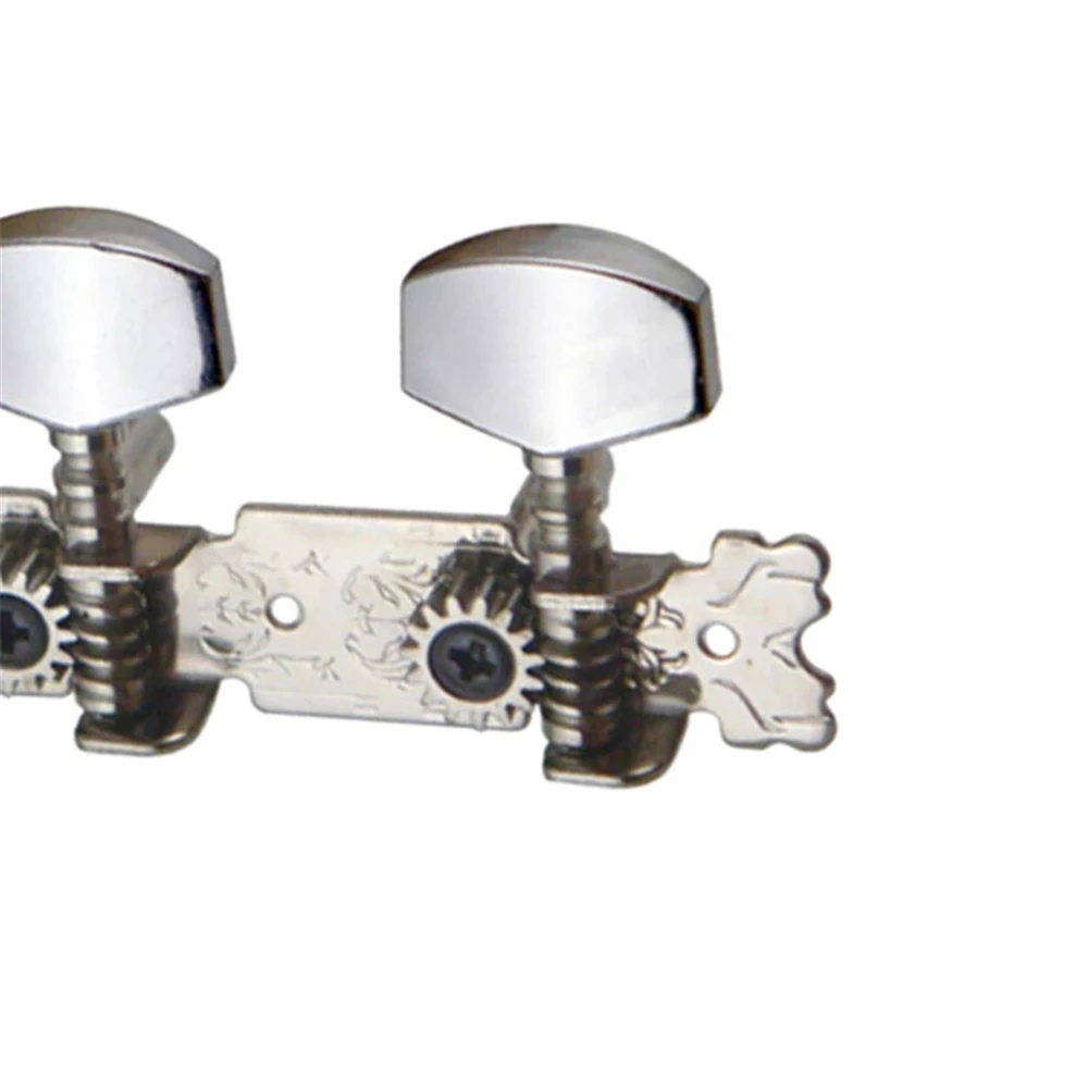 Una cabeza de máquina de guitarra cromada con un diseño decorativo