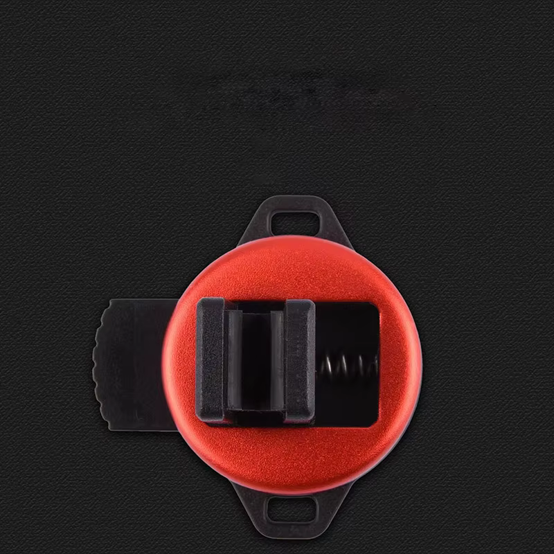 Una abrazadera roja y negra compacta diseñada para aplicaciones de montaje y soporte versátiles