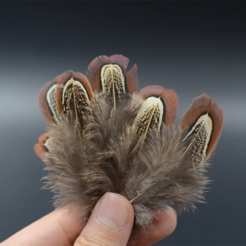Plumas de cuerpo moteadas y tippets de sillín