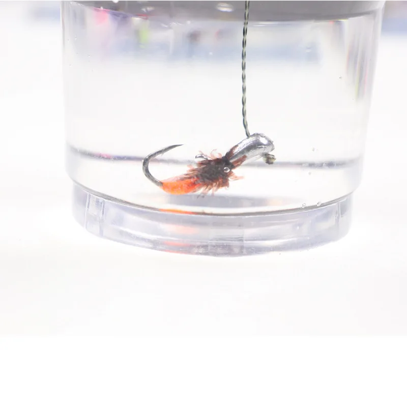 Anzuelos cabeza de plantilla expuestos para pesca en hielo – mosca