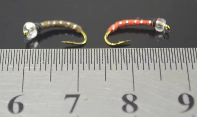 Cabezas de mosca MNFT en color marrón y plata