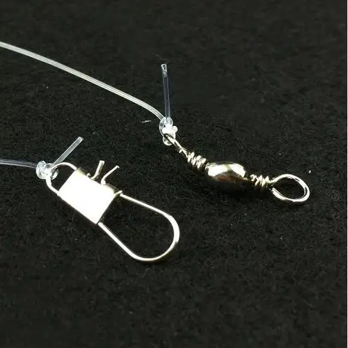 Anzuelo luminoso de acero alto carbono para lubina con plumas de caballa - imagen 5