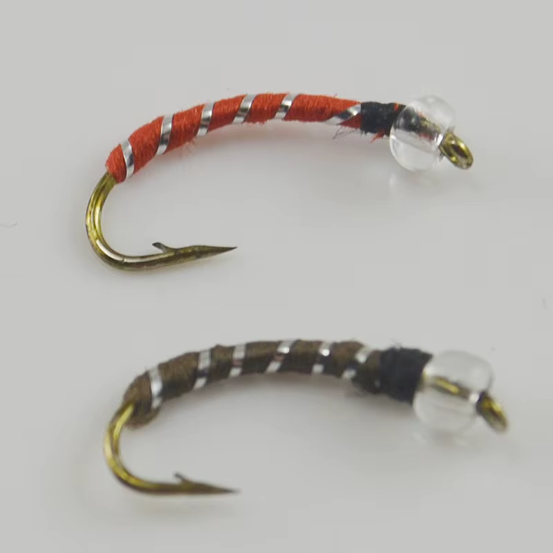 Cabezas de mosca MNFT en color rojo y plata
