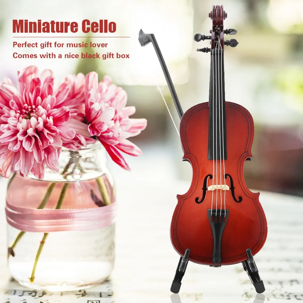 Detalle del violonchelo en miniatura y soporte