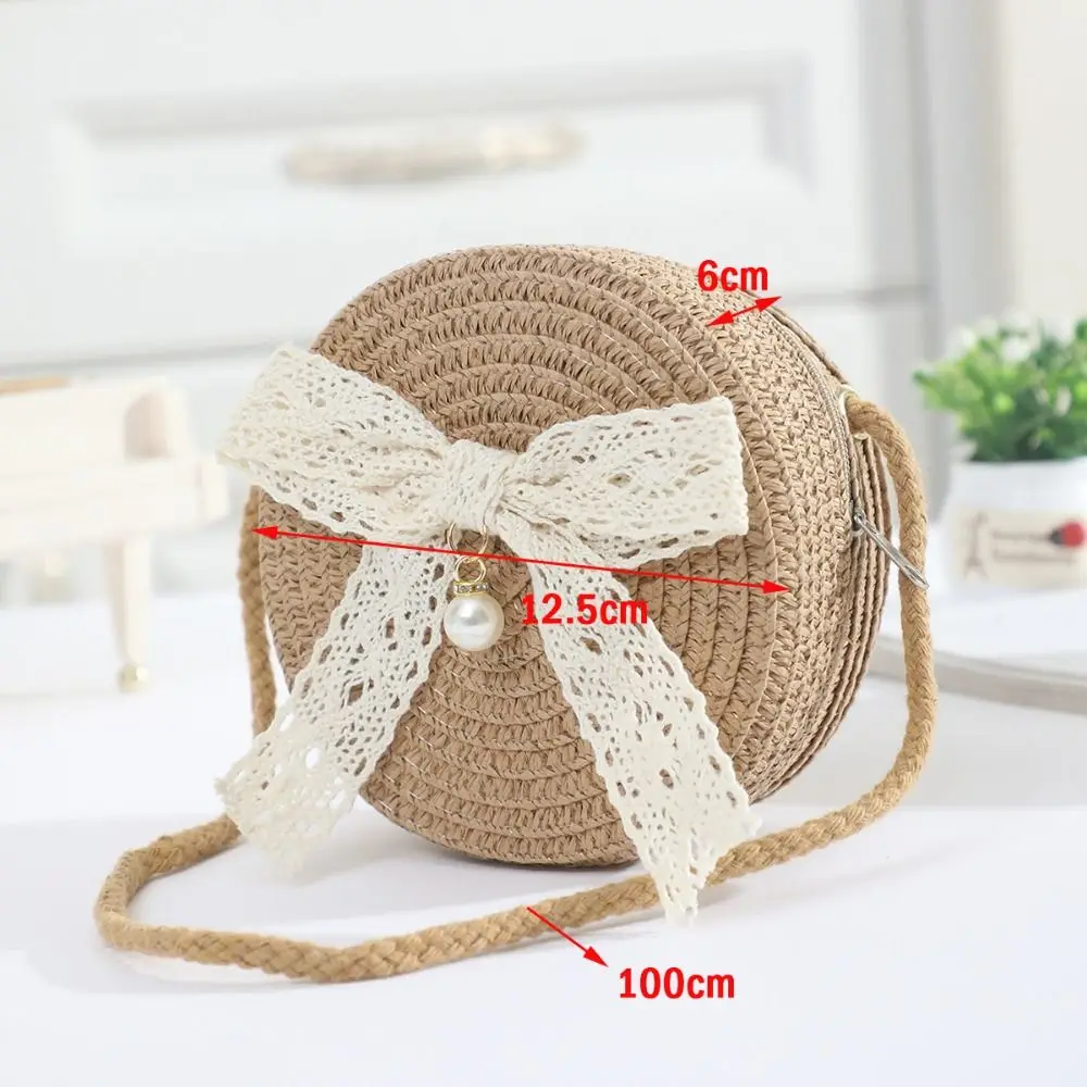 Mini bolso infantil redondo de paja con lazo de encaje