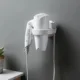Estante de pared adhesivo para secador de pelo y accesorios de baño - imagen 5
