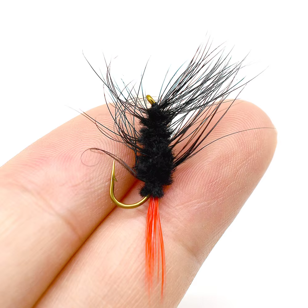 Woolly Bugger: mosca streamer negra y naranja para trucha y perca - imagen 4