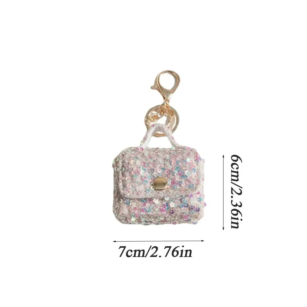 Estuche mini con lentejuelas y llavero