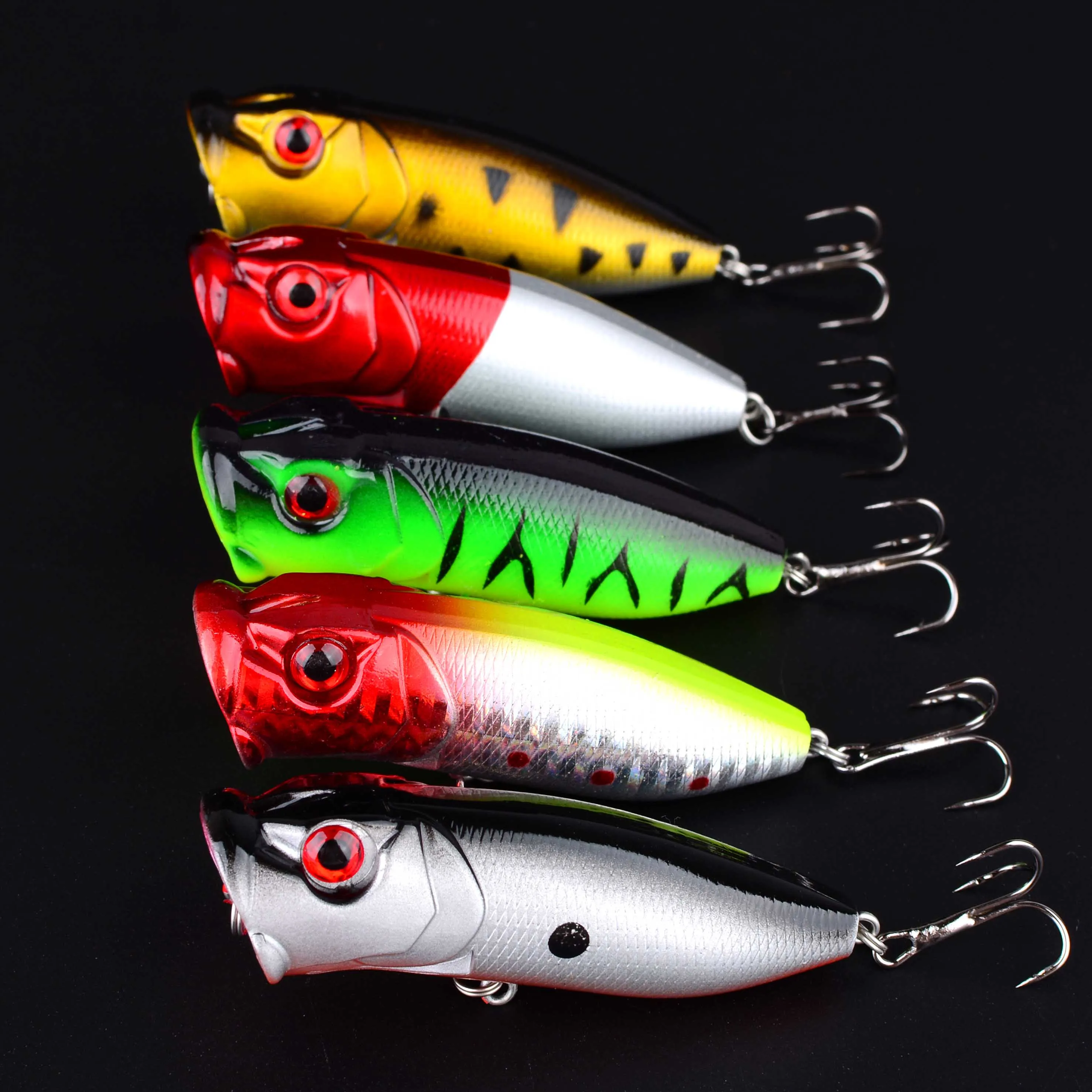 Señuelo popper de pesca artificial vista lateral con anzuelo visible