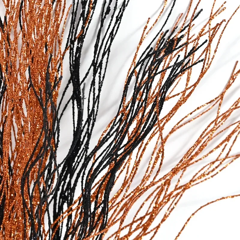 Decoración floral con polvo dorado y bayas negras y naranjas - imagen 3