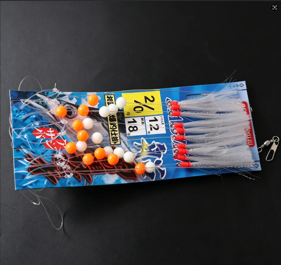 Aparejos de pesca con anzuelos, plumas y cuentas brillantes - imagen 4