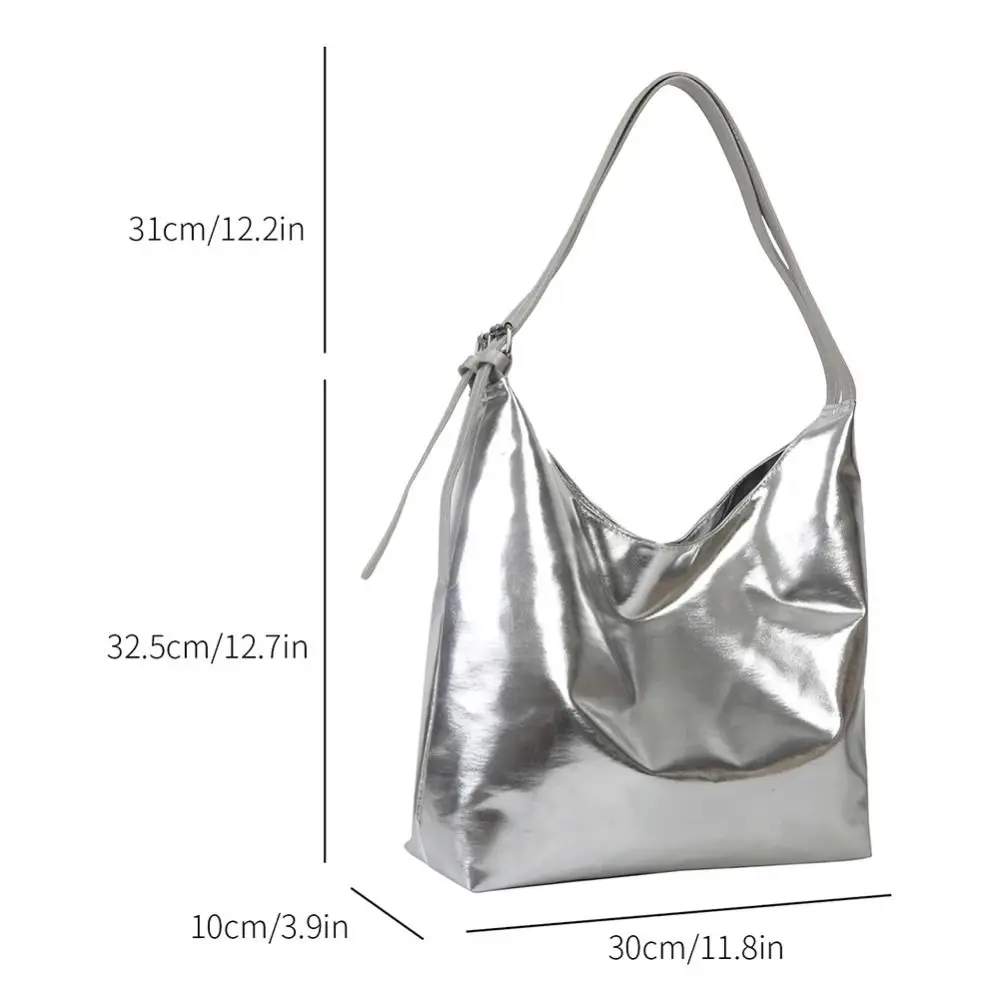 Bolsa de mano en acabado oro/plateado