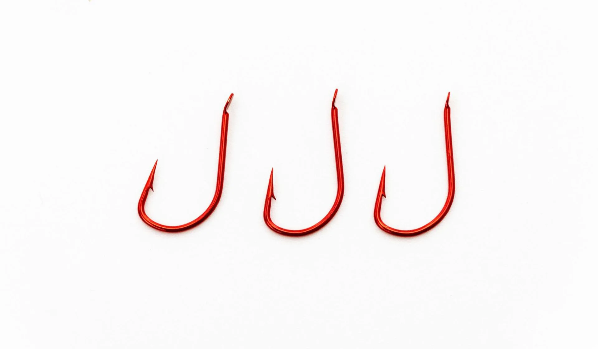 Anzuelos con púas de acero alto carbono rojos para mar y carpas - imagen 4
