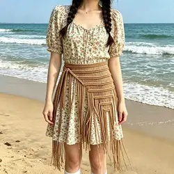 Cinturón boho con flecos y borlas de malla tipo bikini