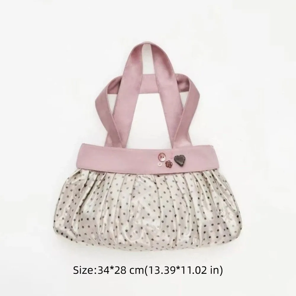 Bolso rosa con lunares y diseño plisado