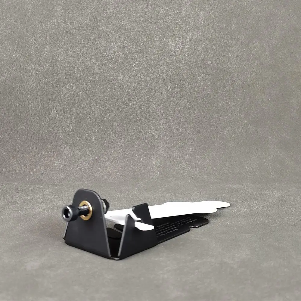 Tornillo de ajuste en la base del objetivo