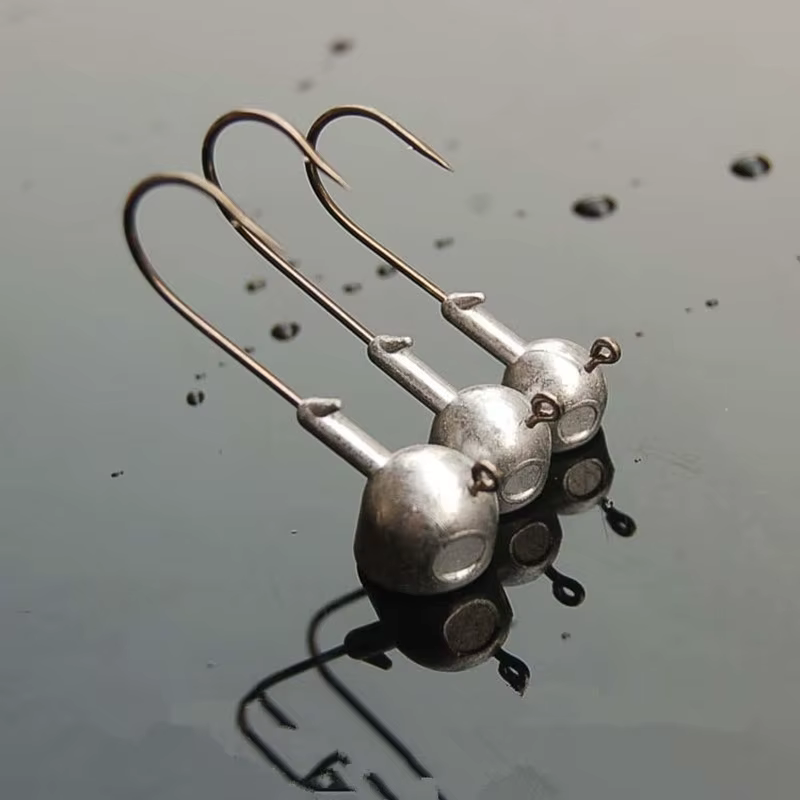 Anzuelo Jig Head con soporte de bola para lubina y vinilo