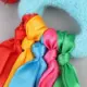 Pulsera elástica infantil con pompones grandes multicolor para baile
