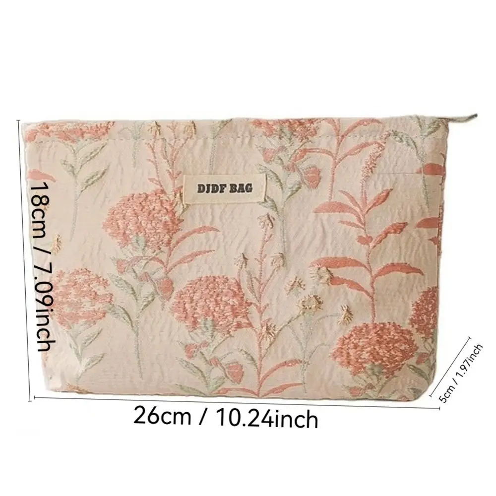 Bolsa de cosméticos crema con bordado floral