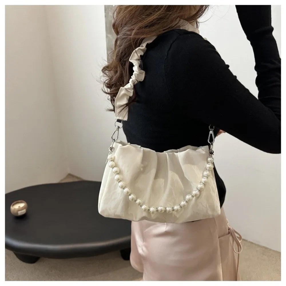 Bolso bandolera tipo crossbody con caída de cadena