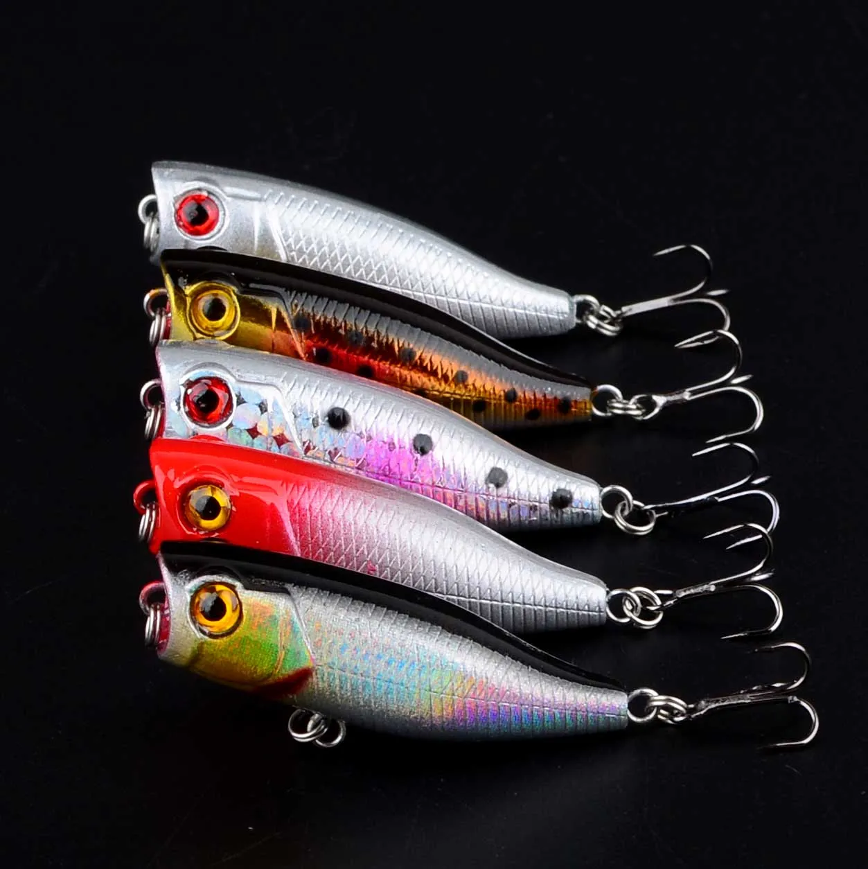 Señuelo popper de pesca en vista lateral mostrando su diseño