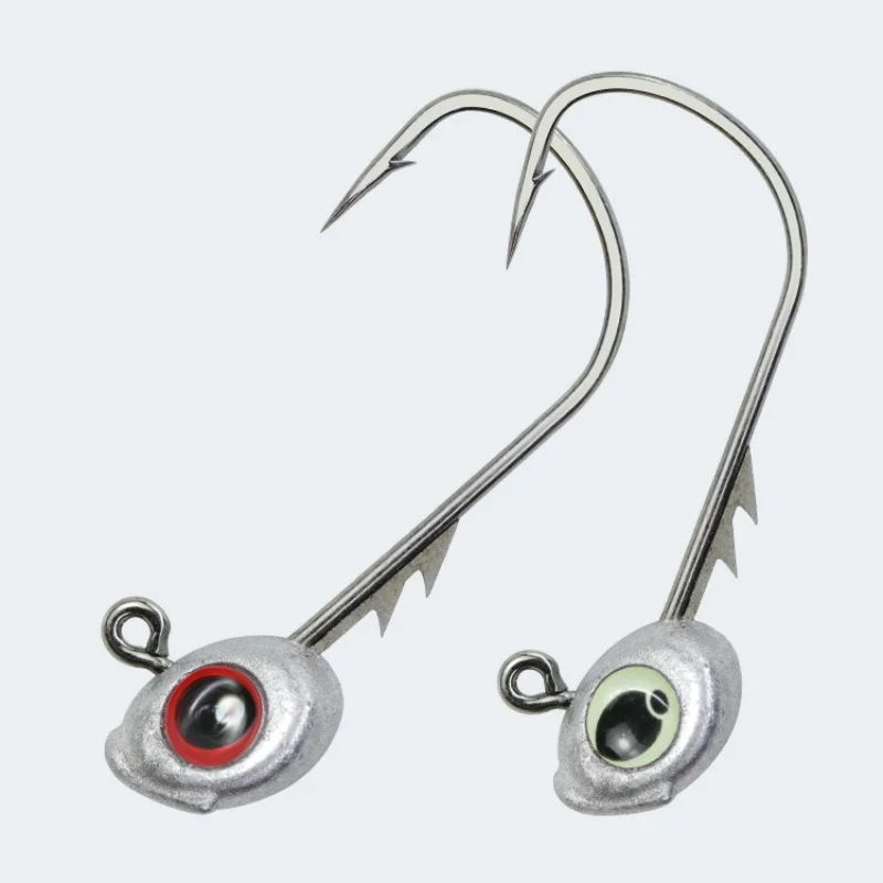 Detalle del anzuelo WLDSLURE con ojo rojo brillante y doble púa