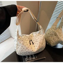 Bolso bandolera hobo de pana a rayas con cierre y lazo