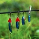 Goture señuelo giratorio metálico con plumas y lentejuelas - imagen 3