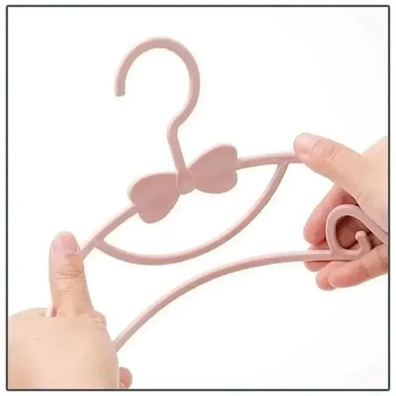 Perchas de plástico para ropa infantil: ganchos organizadores hogar - imagen 2